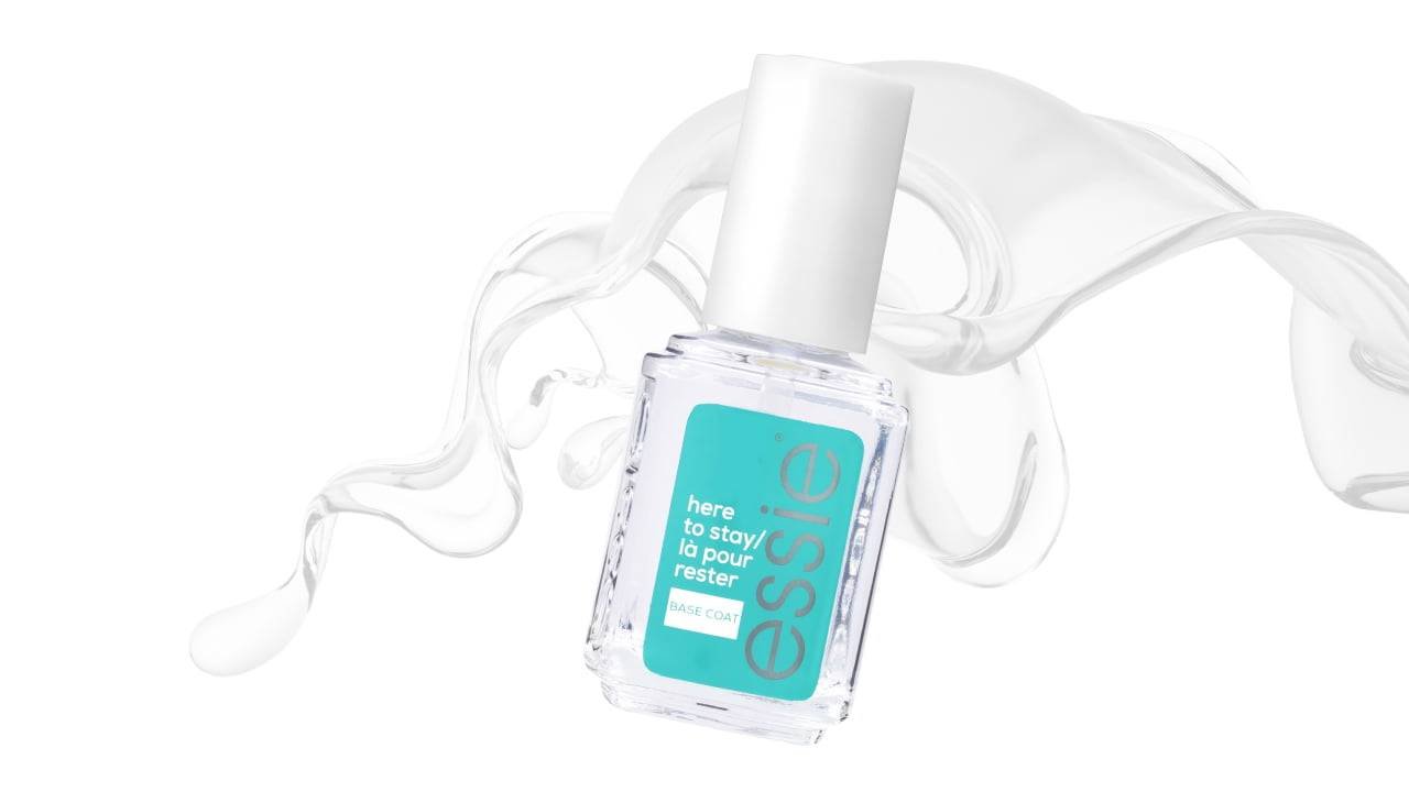 Essie base coat against a white background with liquid floating behind it