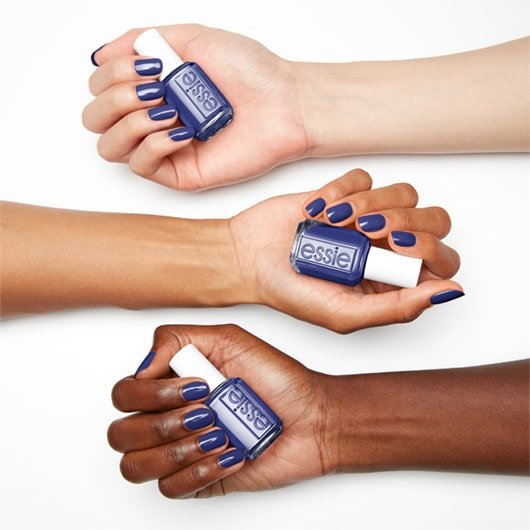 new day new me deeply saturated blue nail polish on 3 skin tones