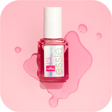 Fortifiant pour les ongles hard to resist d’essie avec une teinte rose sur un fond rose