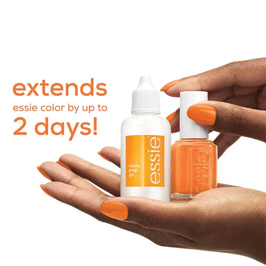 hands holding a bottle of orange essie nail polish and a bottle of essie's 3-in-1 cuticle remover