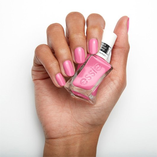 haute to trot pink nail polish on medium skin tone