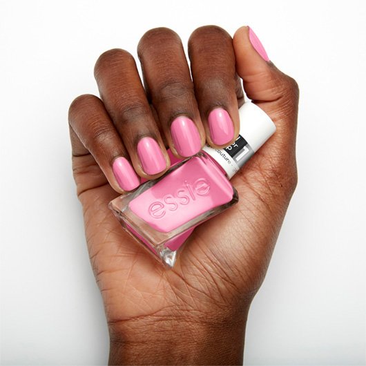 haute to trot pink nail polish on dark skin tone